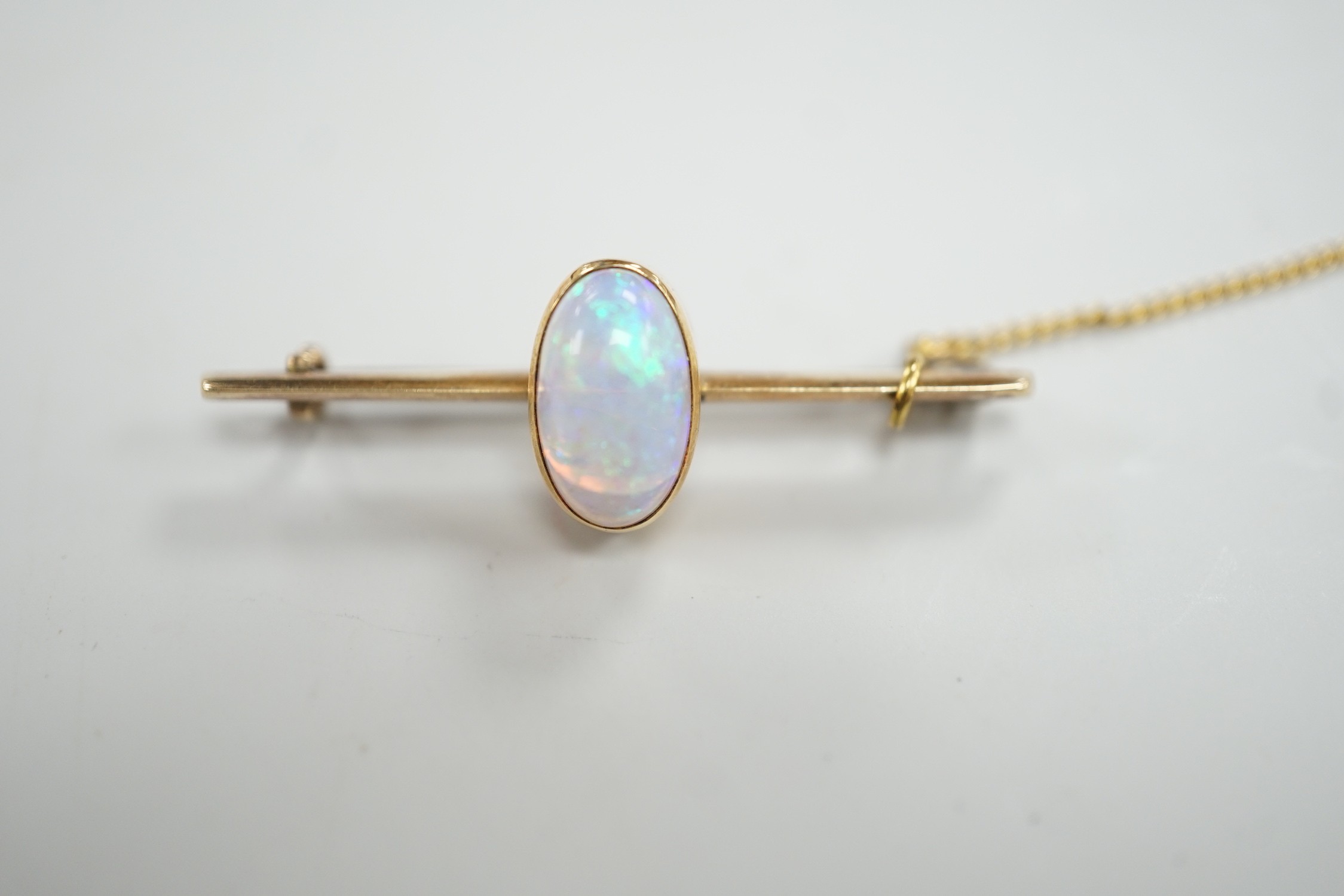 A yellow metal and single stone oval white opal set bar brooch, 39mm, gross weight 4.3 grams. - Image 2 of 4