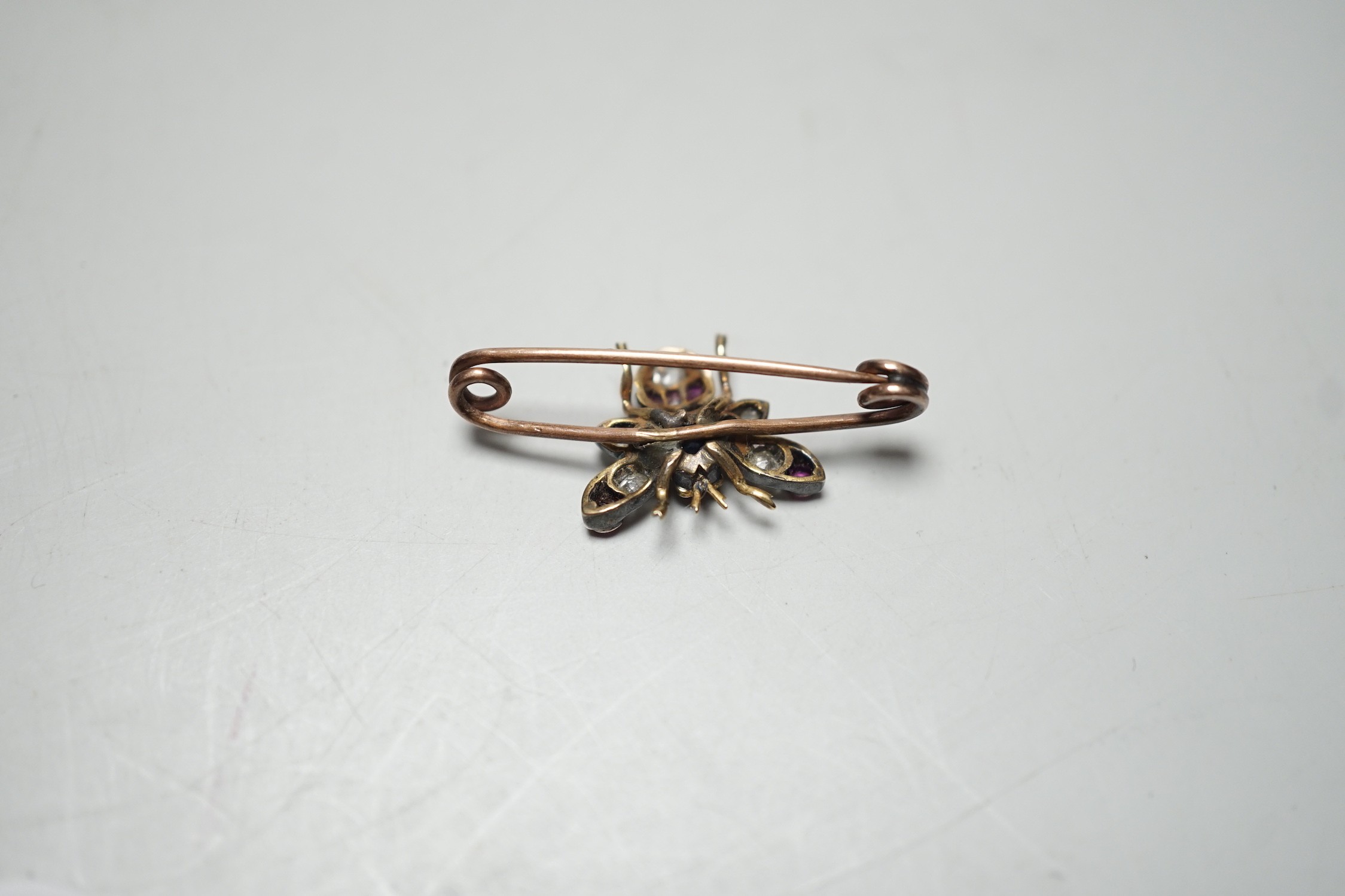 A late Victorian yellow metal, ruby, sapphire and diamond set bug brooch, 30mm, gross weight 2.2 - Image 4 of 4