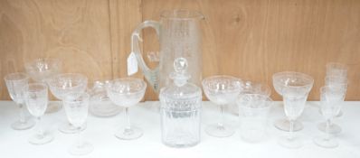 A selection of various engraved glassware, together with a cut glass decanter and stylish jug.
