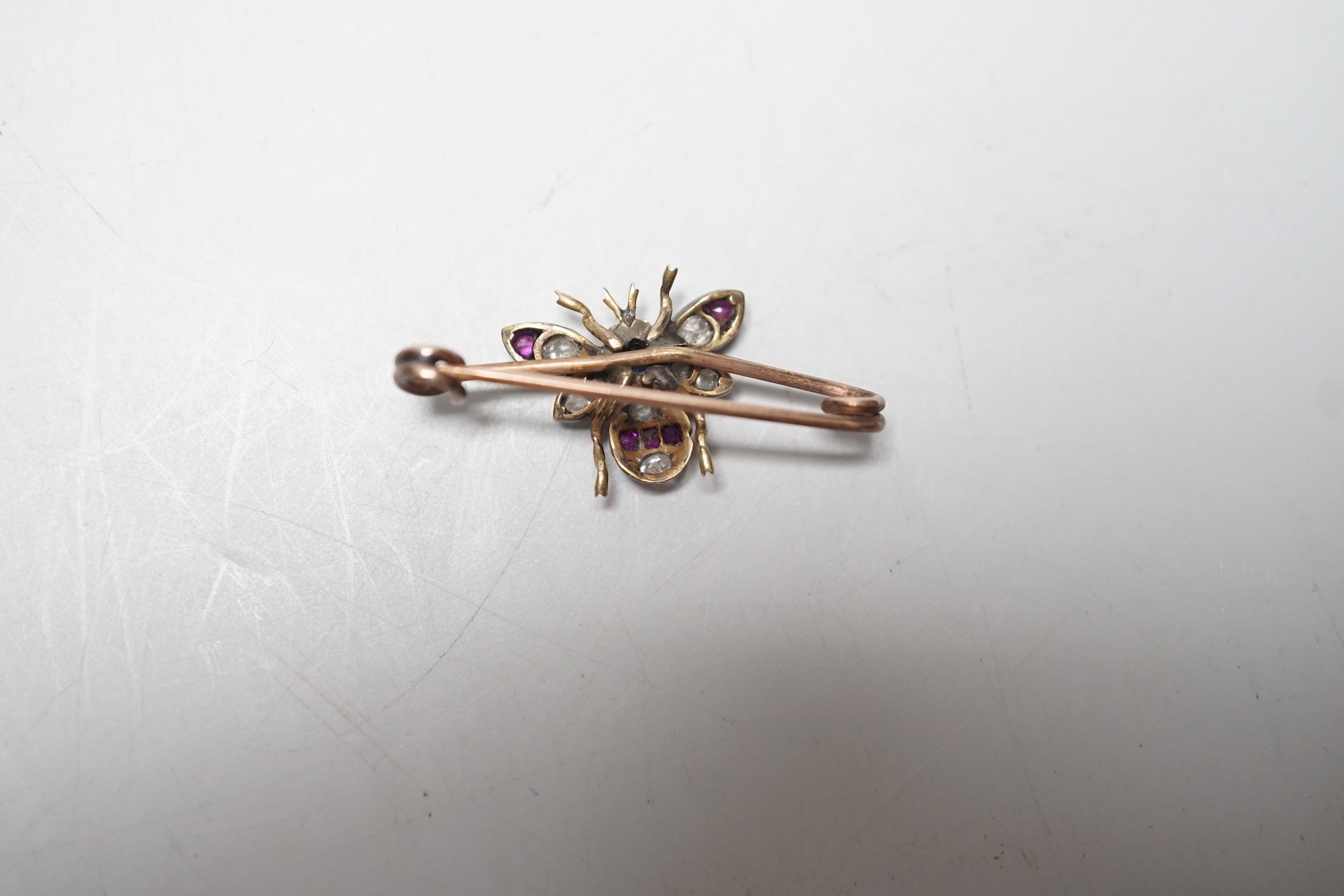 A late Victorian yellow metal, ruby, sapphire and diamond set bug brooch, 30mm, gross weight 2.2 - Image 3 of 4