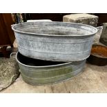 A pair of oval vintage galvanised zinc water troughs, length 104cm, depth 58cm, height 28cm together