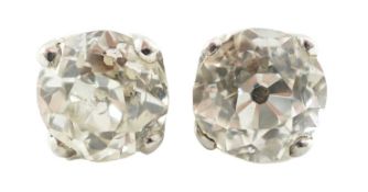 A pair of white gold? and solitaire diamond set ear studs, the stones approximately 5.6mm and 5.8m