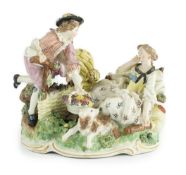 A Frankenthal porcelain bucolic group of two lovers, c.1777, modelled with a woman reclining against