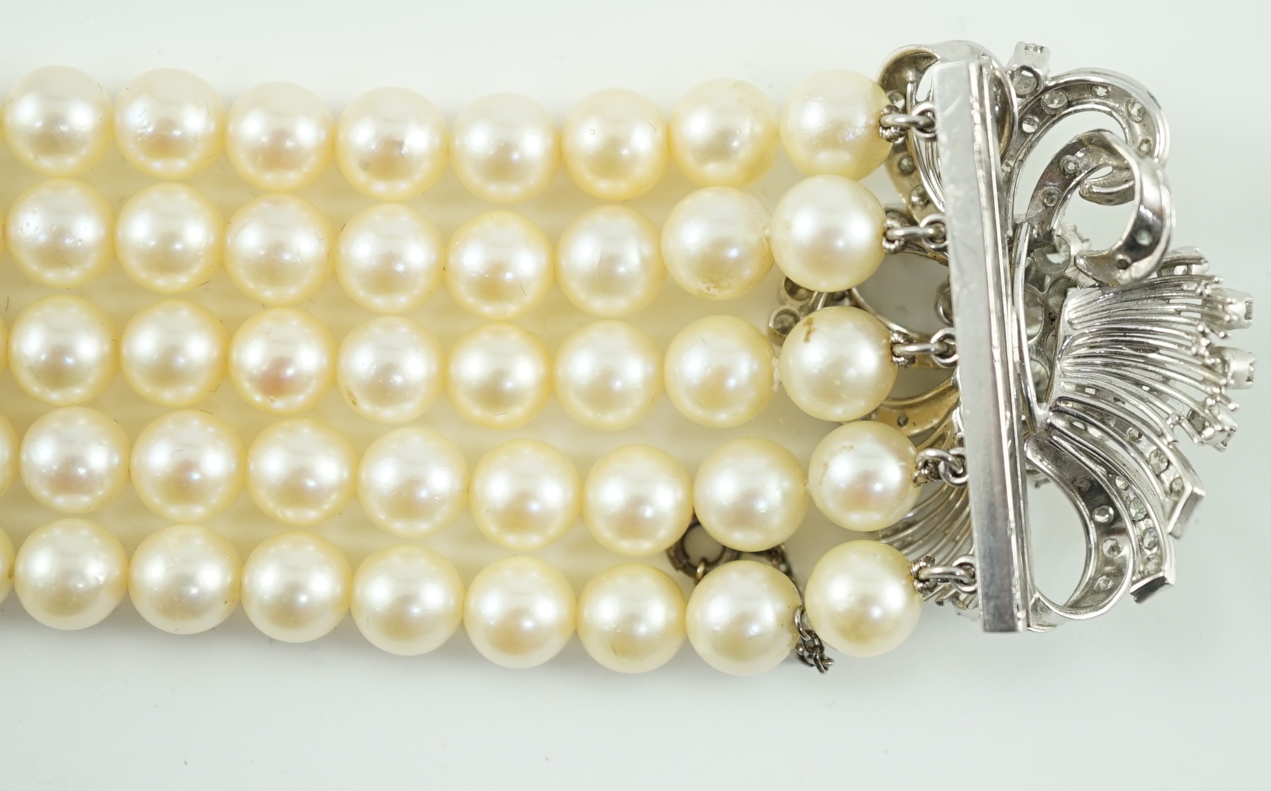 A mid to late 20th century continental quintuple strand cultured pearl bracelet, with white gold and - Image 7 of 7