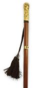 A 19th century French gold mounted hardwood swordstick, with concealed blued steel stiletto blade,