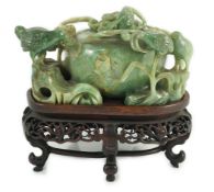 A Chinese jadeite ‘quail and millet’ water pot and stand, late 19th century, carved in high relief