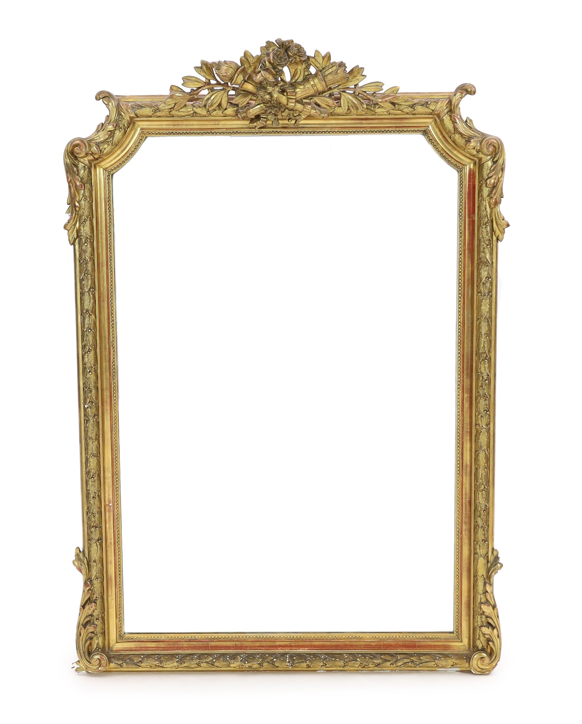 A late 19th century French giltwood and gesso overmantel mirror, with flower, quiver and torch