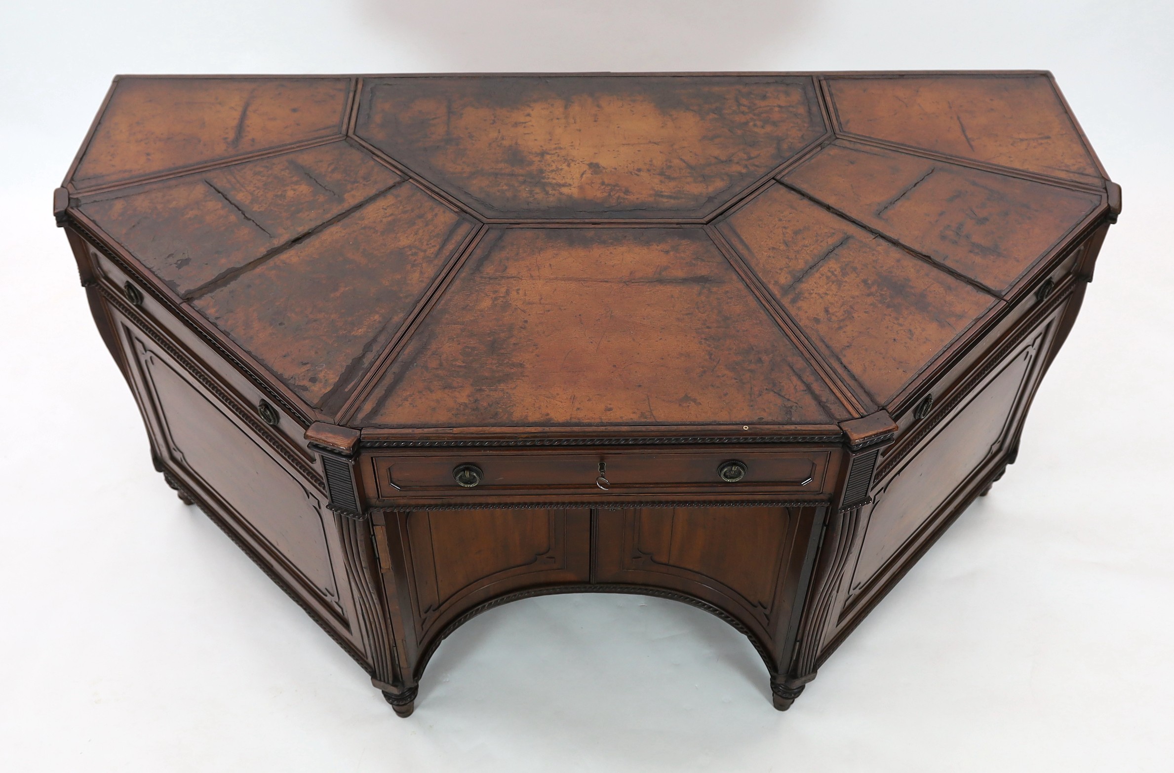 An unusual George IV mahogany kneehole desk, of demi-octagonal form, with segmented leather lined - Image 2 of 4