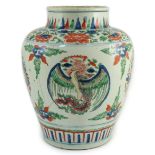 A Chinese Transitional wucai ‘dragon and phoenix roundel’ vase, 17th century, the roundels between