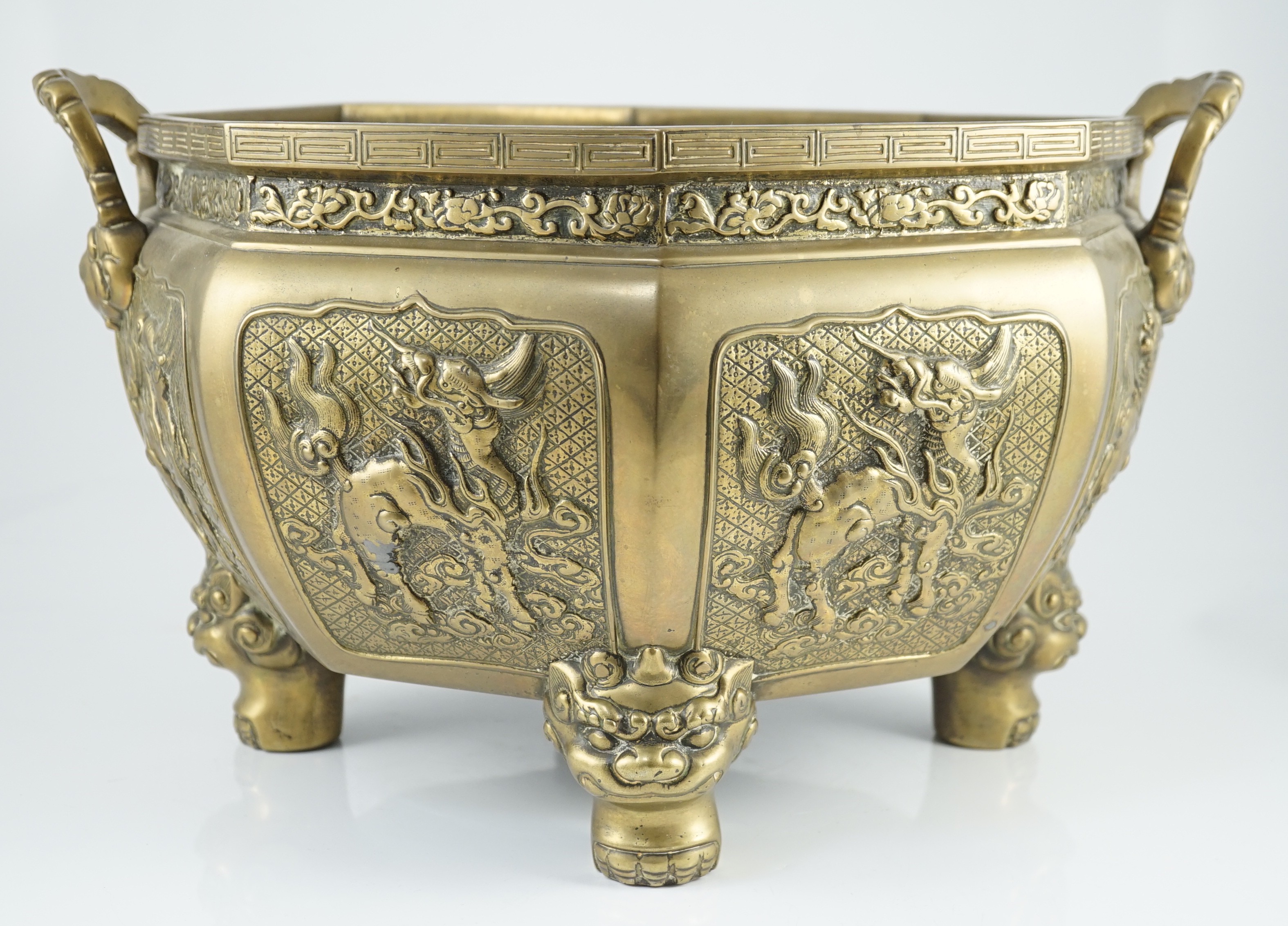A large Chinese polished bronze octagonal jardiniere, 19th century, each side cast in relief with - Image 6 of 9