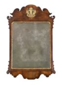 A George II walnut and parcel gilt fret frame wall mirror, with Prince of Wales feathered crest