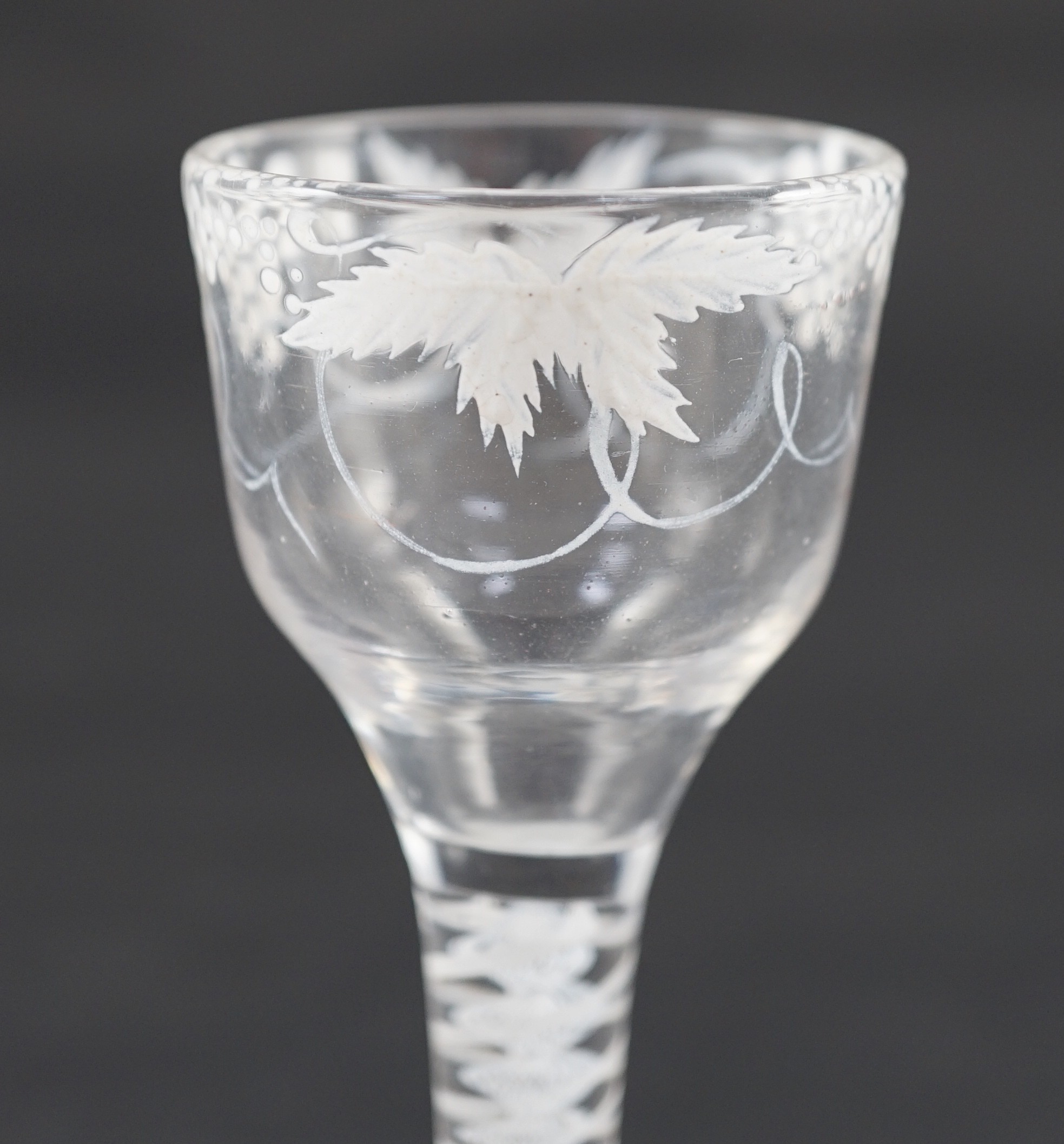 A Beilby enamelled wine glass, c.1765, the ogee bowl painted with fruiting vine in opaque white, - Image 5 of 6