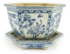 A Chinese hexagonal blue and white planter and underdish, 19th century, painted with alternating