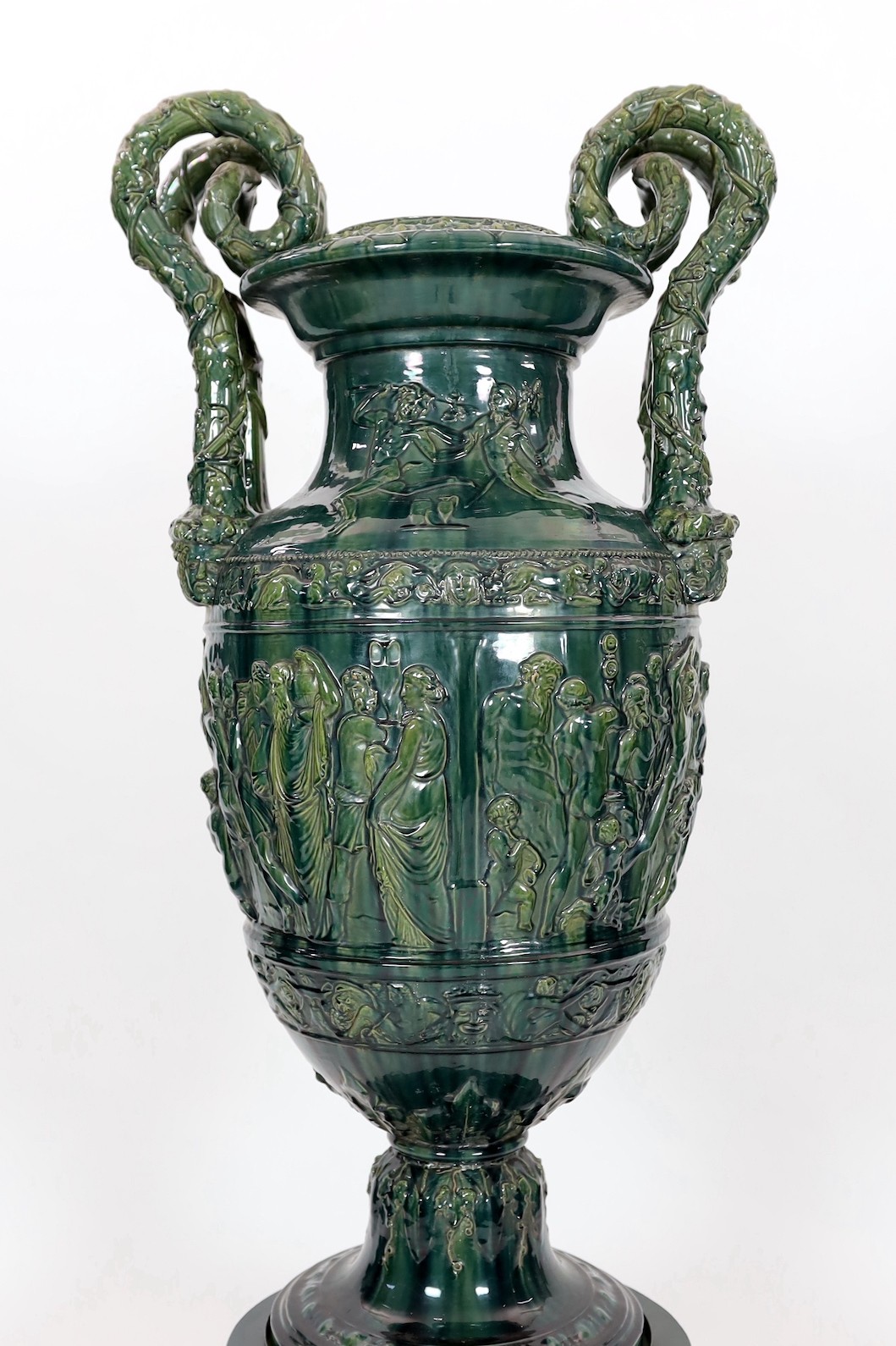 A massive Continental majolica green glazed campana vase and associated stand, late 19th century, - Image 2 of 6