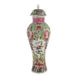 A Chinese famille rose moulded baluster vase, Qianlong period, painted with trailing flowers on a