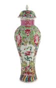 A Chinese famille rose moulded baluster vase, Qianlong period, painted with trailing flowers on a