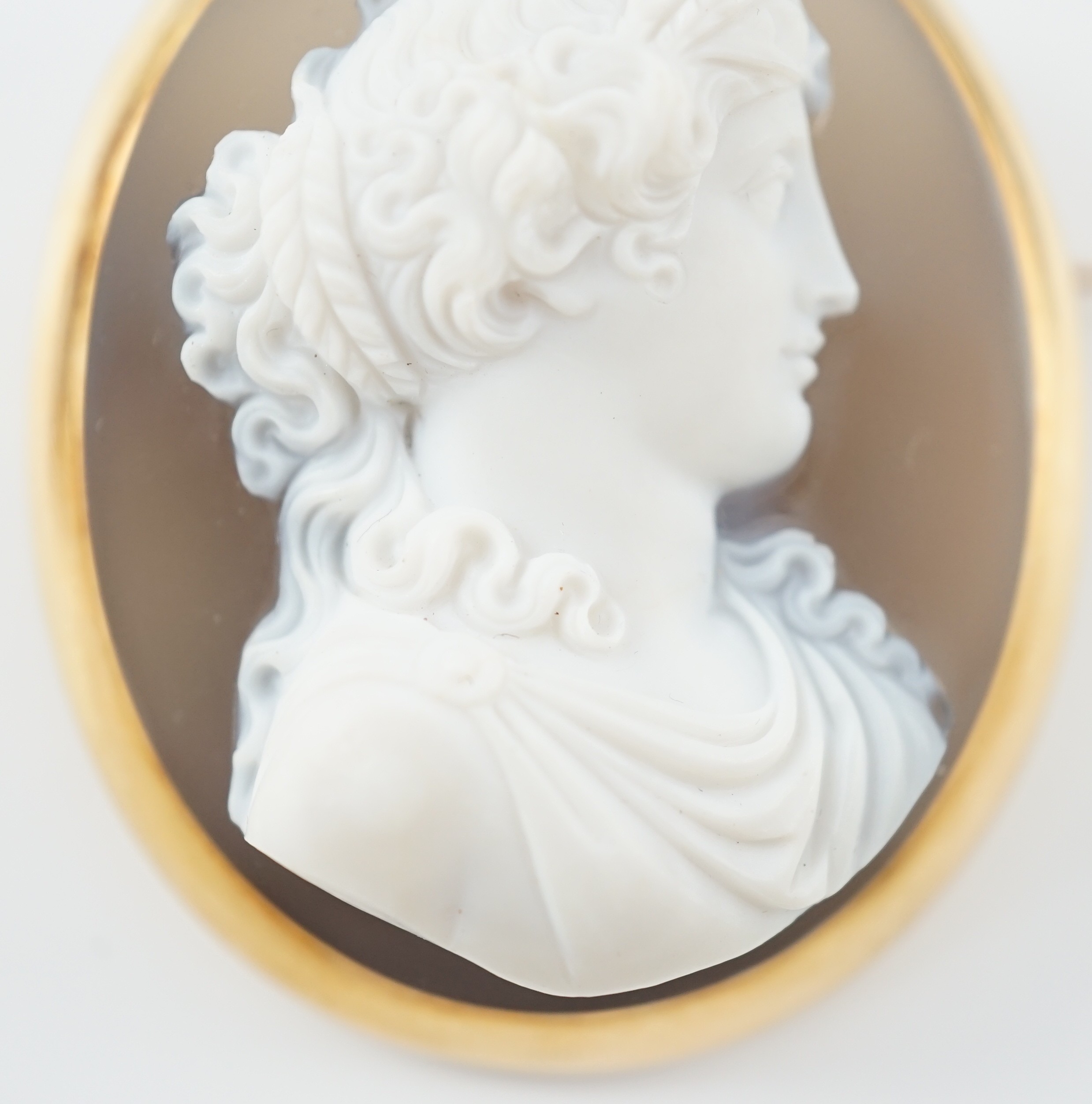 A late 19th/early 20th century gold mounted chalcedony cameo set oval brooch, carved with the bust - Image 3 of 5