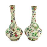 A pair of Chinese enamelled porcelain crackle glaze bottle vases, mid 19th century, each painted