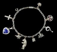 A 9ct white gold charm bracelet, with French platinum and diamond set clasp and hung with nine