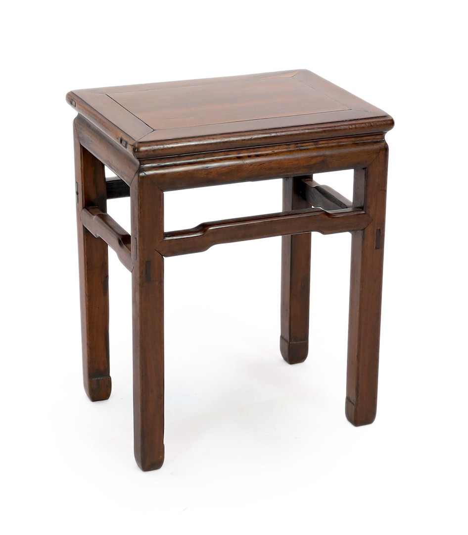 A Chinese huanghuali and hongmu stool, 18th/19th century, the panelled rectangular top above a