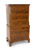 A George I inlaid walnut chest on chest, with moulded cornice, three short and three graduated