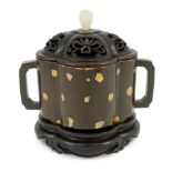 A Chinese gold splashed bronze quatrelobed censer, dark brown patinated with gold splashes,