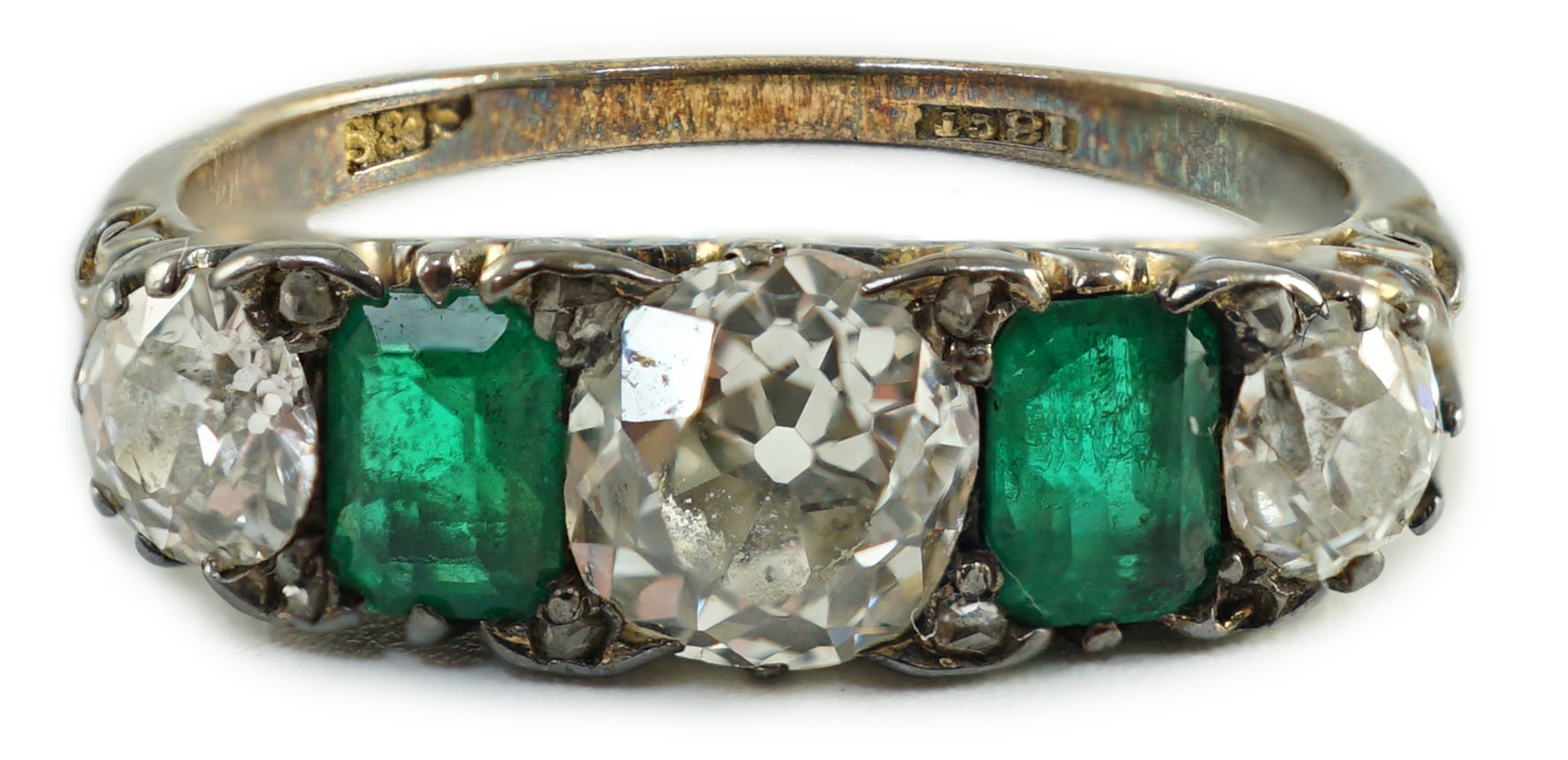 An early 20th century 18ct gold, three stone diamond and two stone emerald set half hoop ring, - Image 6 of 10
