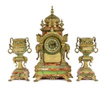 A late 19th century French ormolu mounted marble and green onyx clock garniture, of Indian