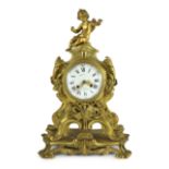 Bernoux of Paris. A 19th century Louis XV style ormolu mantel clock, with putto finial, enamelled