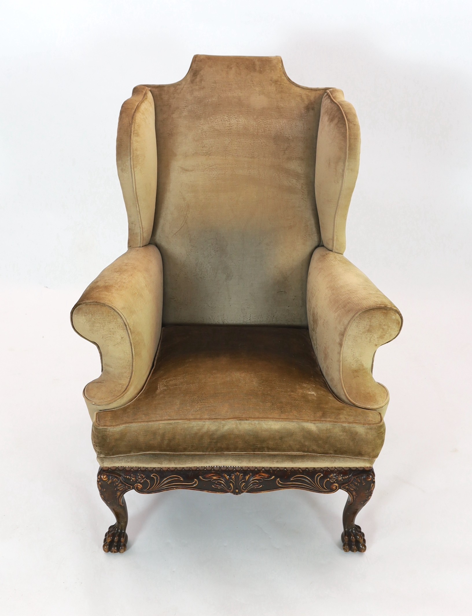 An Irish mahogany wing armchair, in George III style, with foliate scroll carved apron, on - Image 2 of 4