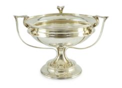 An Edwardian Art Nouveau silver tri-handled pedestal fruit bowl, by Joseph Rodgers & Sons, with