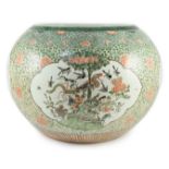 A large Chinese famille verte jardiniere or fish bowl, 19th century, painted to four reserves with a