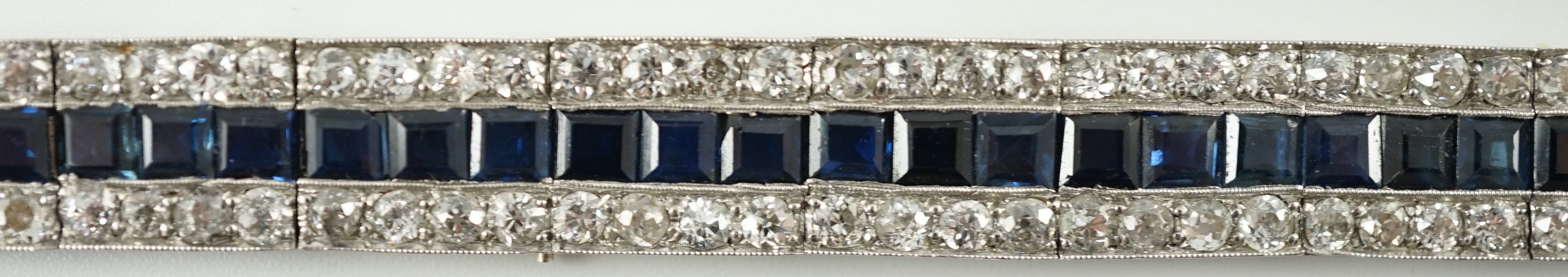 A 1920’s white gold, sapphire and diamond set triple line bracelet, with engraved setting and two - Image 5 of 9