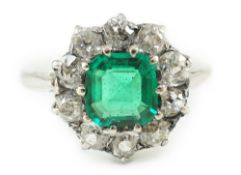An early to mid 20th century, platinum, octagonal cut emerald and round cut diamond set circular