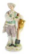 A Meissen figure of a gardener, c.1770, modelled by Michel Victor Acier, holding a posy of flowers