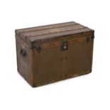 A Louis Vuitton brass mounted leather bound trunk, c.1910, numbered 137426, with LV covering and