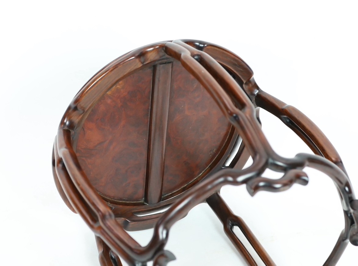 A Chinese hongmu and burr wood small stool, 19th century, the circular the inset top above a pierced - Image 4 of 4