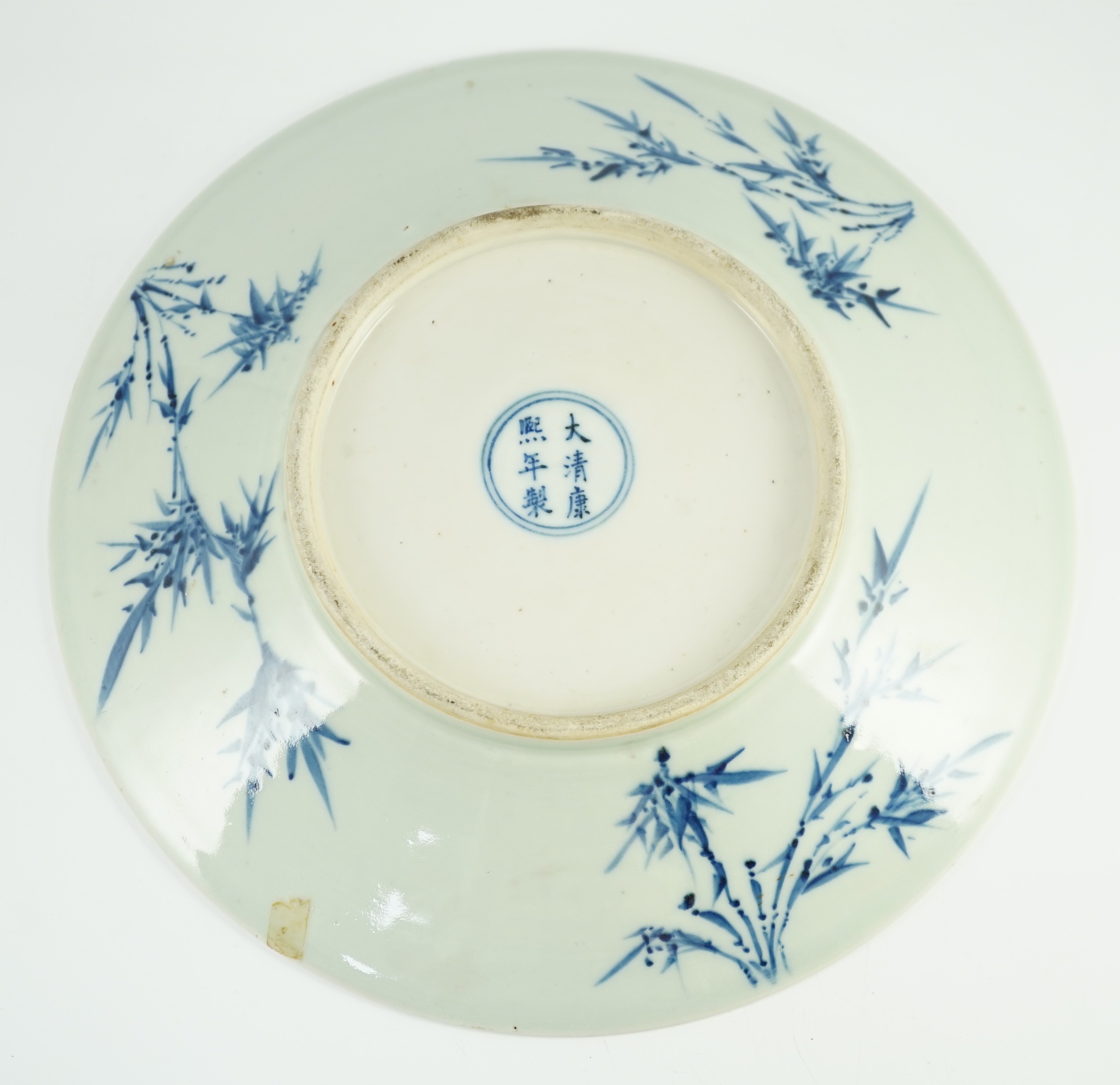 A Chinese blue and white dish, Kangxi mark, 19th century, the centre painted with four - Image 6 of 7