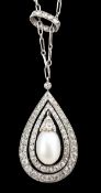 An early 20th century platinum, cultured? pearl and diamond cluster set pear shaped drop pendant