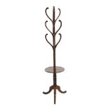 A Regency mahogany hat stand, with central spiral twist column and nine scrolling arms over circular