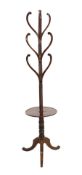 A Regency mahogany hat stand, with central spiral twist column and nine scrolling arms over circular
