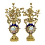 A pair of large French Sevres style ormolu mounted candelabra, in Louis XVI style, 19th century,