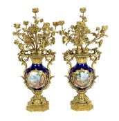 A pair of large French Sevres style ormolu mounted candelabra, in Louis XVI style, 19th century,