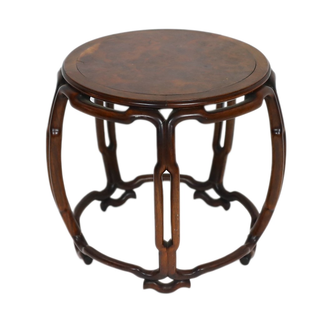 A Chinese hongmu and burr wood small stool, 19th century, the circular the inset top above a pierced