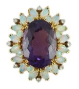 A modern 18ct gold and oval cut amethyst set pendant, with round and marquise cut white opal and
