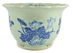 A Chinese blue and white celadon ground flower pot, late 19th century, moulded in white slip and