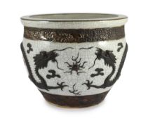 A Chinese crackle glaze 'dragon' jardiniere, late 19th century, moulded in relief and painted in
