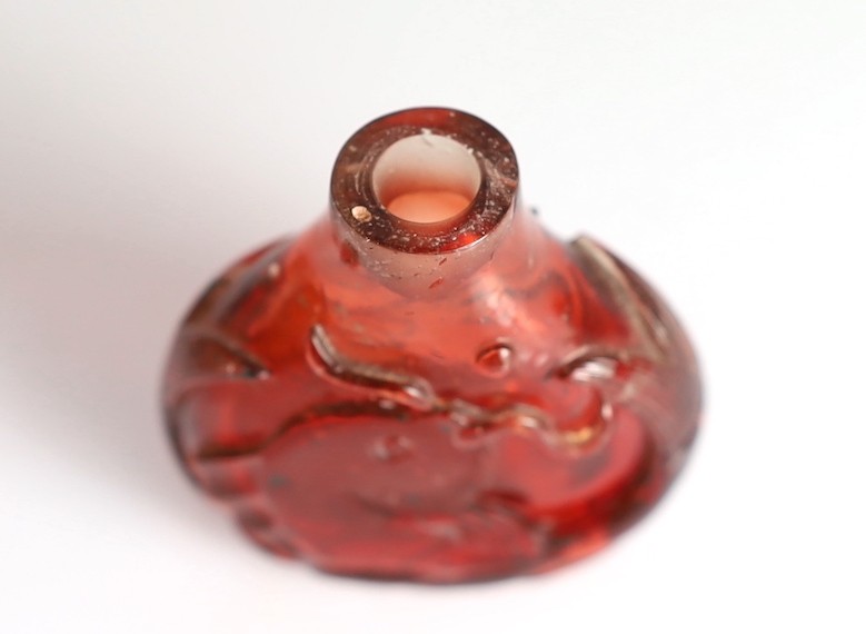 A Chinese ruby red glass ‘leaping carp’ snuff bottle, 1750-1850, each side carved in high relief - Image 5 of 6
