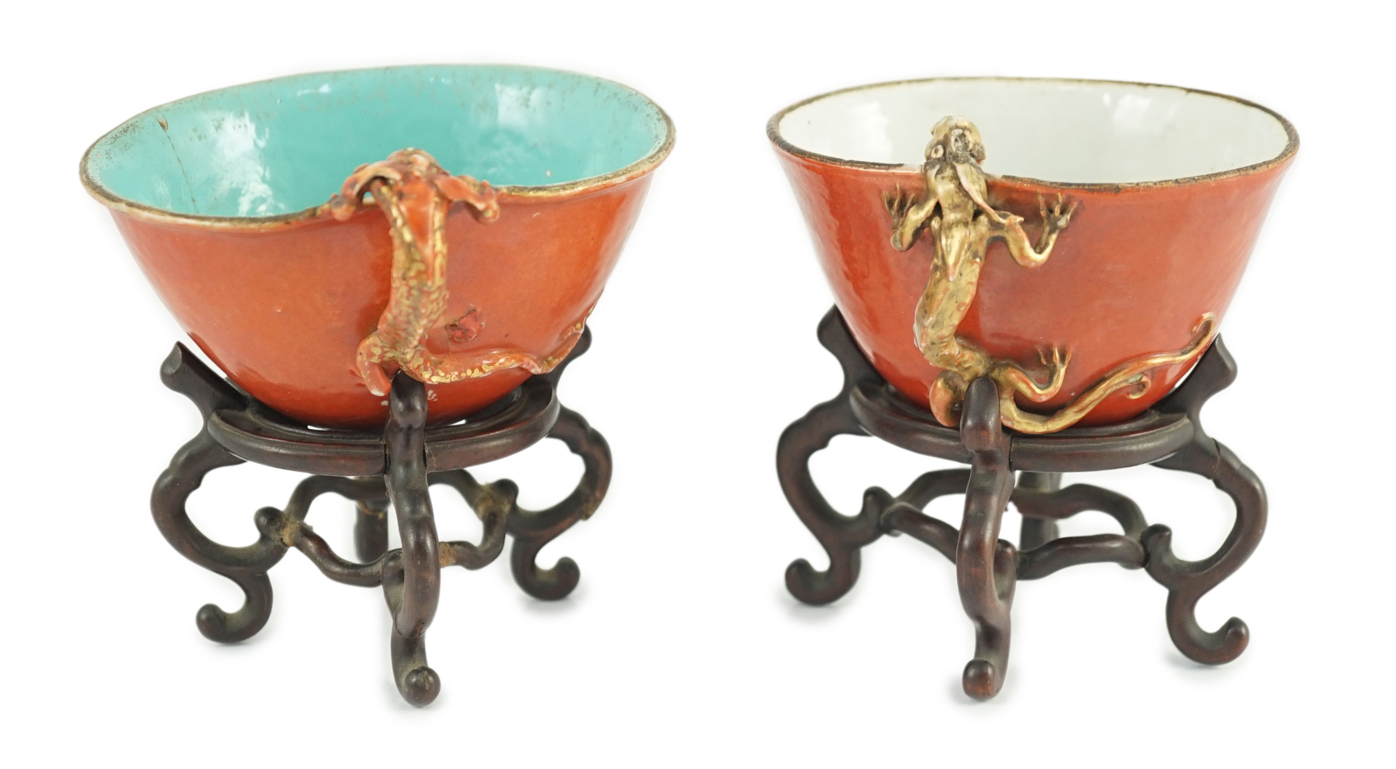 Two similar Chinese coral ground libation cups, late 18th/early 19th century, each of oval