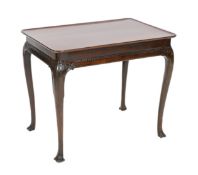 A George I Irish mahogany silver table, with rectangular tray top and acanthus carved slender